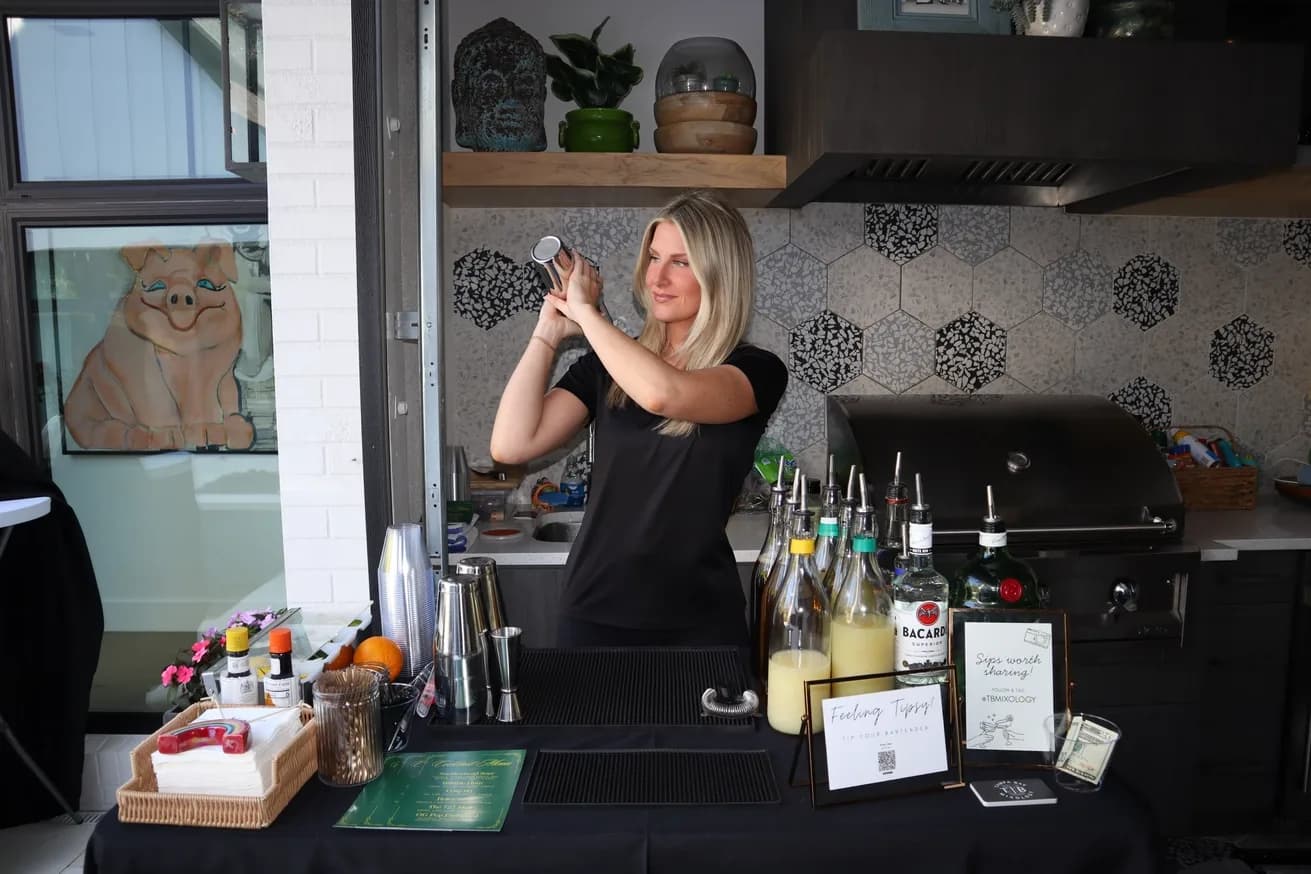 Bartender shaking a cocktail at a mobile bar