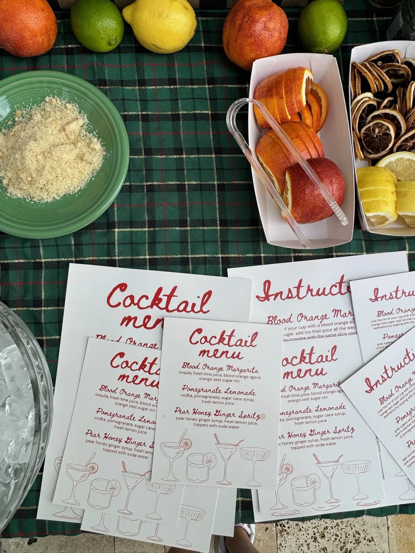 Custom cocktail menus with fresh citrus garnishes and dehydrated fruit