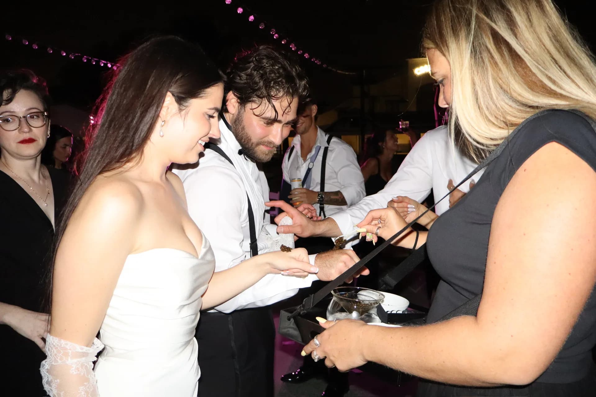Couple tasting caviar at a TB Mixology event