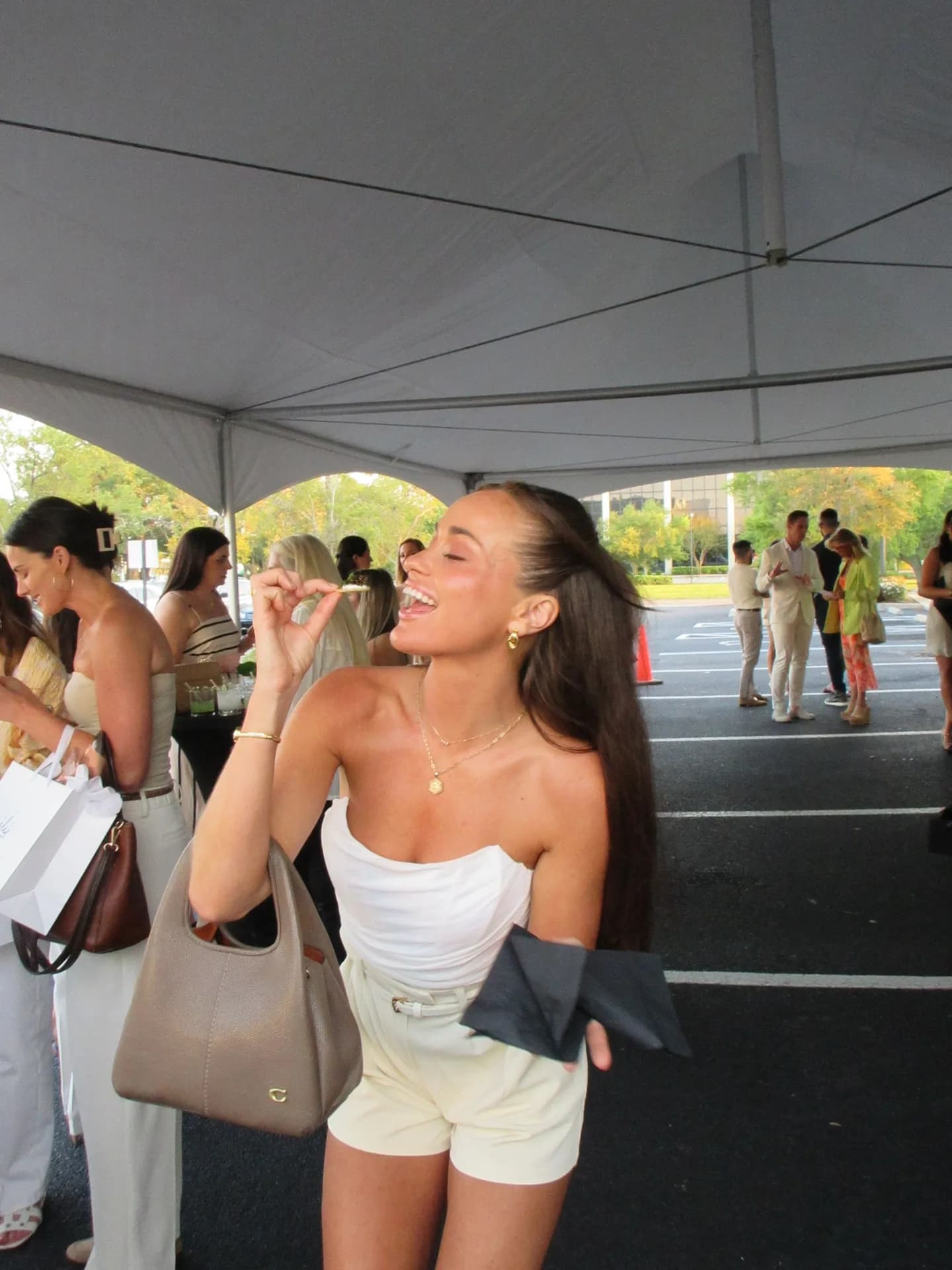 Guest enjoying caviar service under outdoor tent
