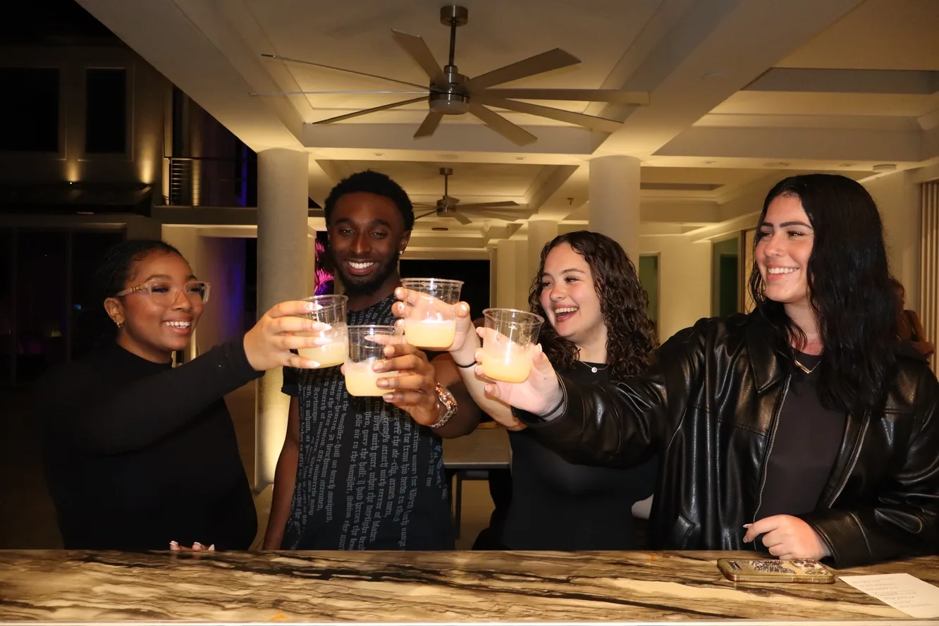 Friends cheersing cocktails at an upscale birthday venue