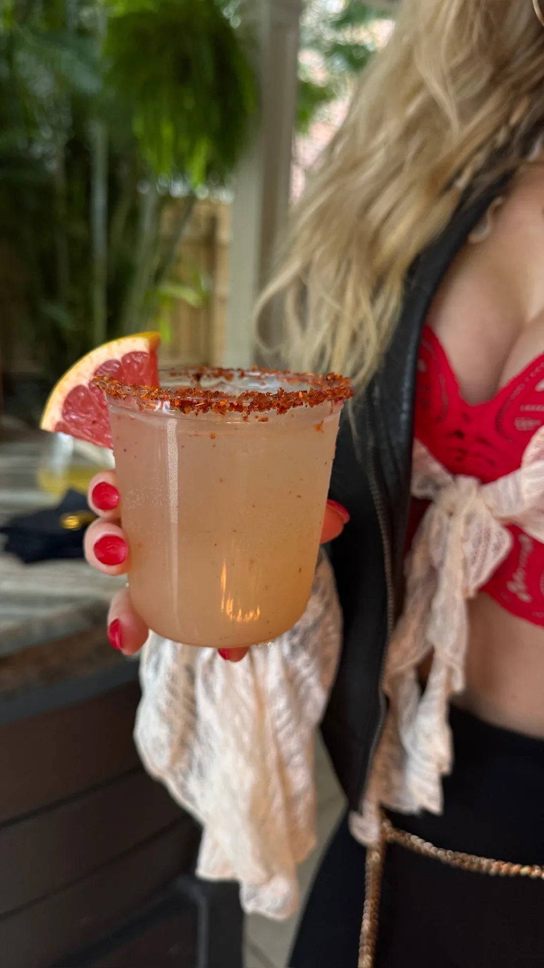Spicy paloma cocktail with tajin rim and grapefruit at Gasparilla party