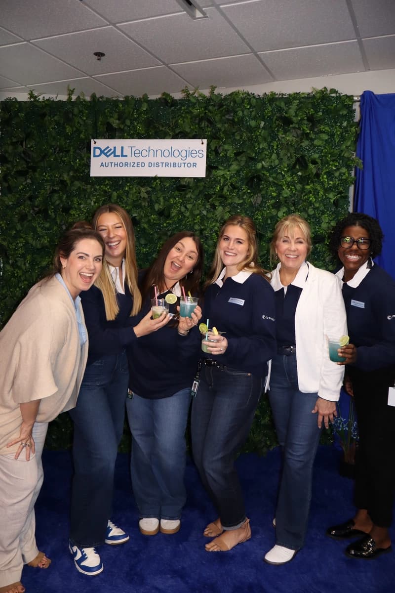 Group of women holding colorful mocktails at Dell corporate event