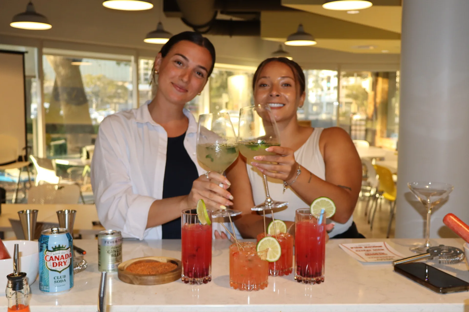 TB Mixology bartenders cheersing hugo spritz and margarita at Rays venue