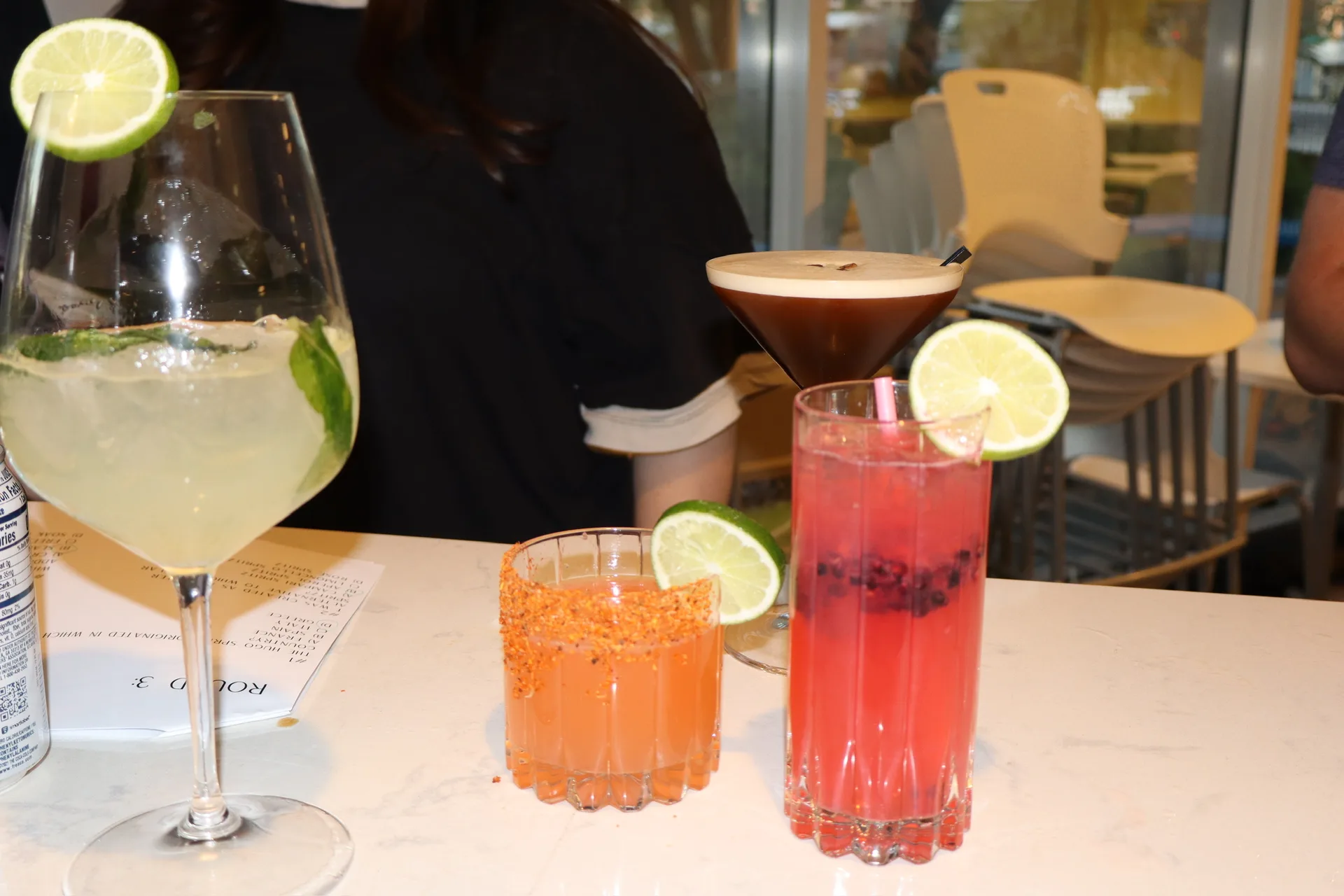 Four craft cocktails lined up at Rays corporate cocktail class
