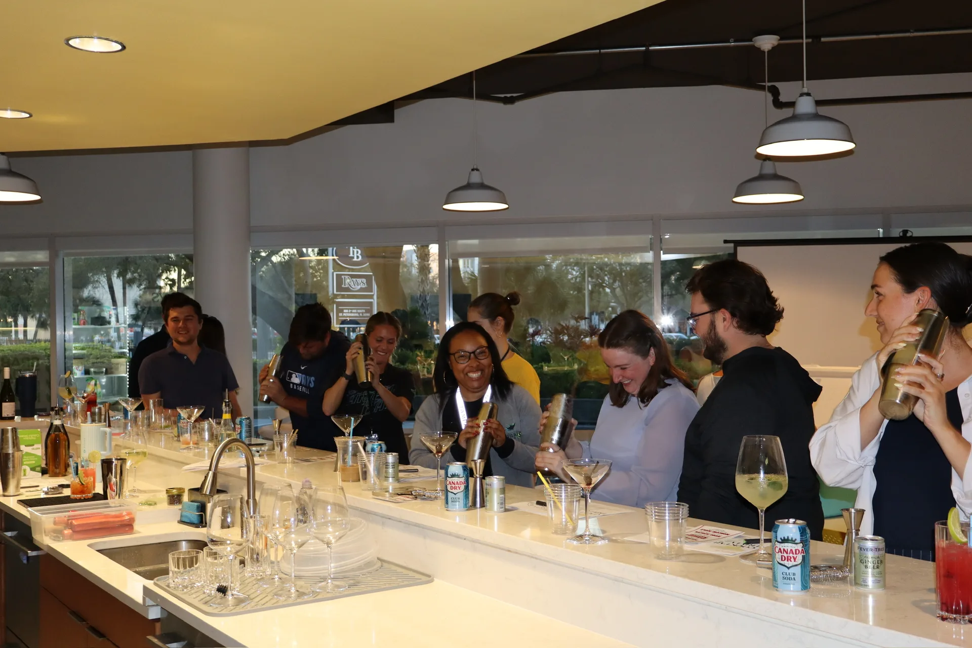 Full Rays staff group mixing cocktails at team building event