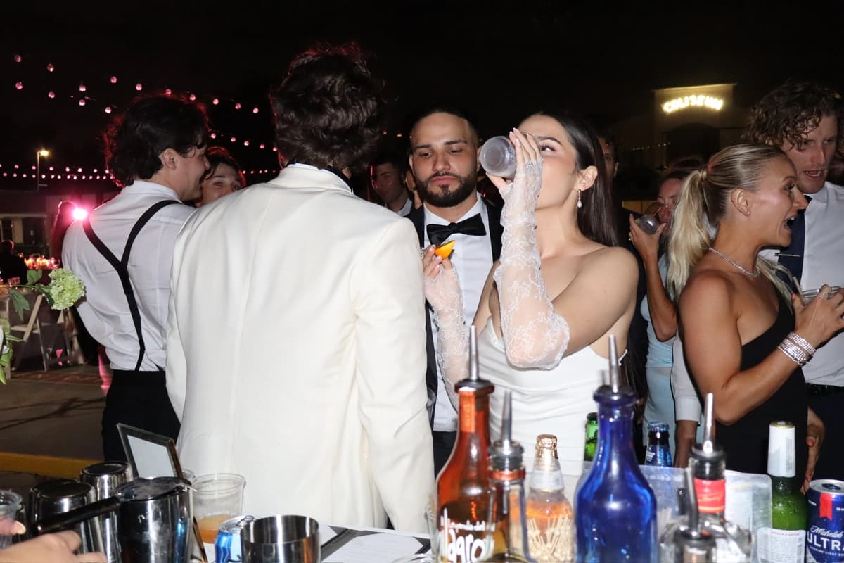 Bride drinking at the mobile bar during wedding reception