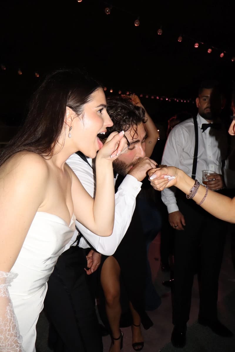 Bride and groom laughing on the dance floor at wedding reception