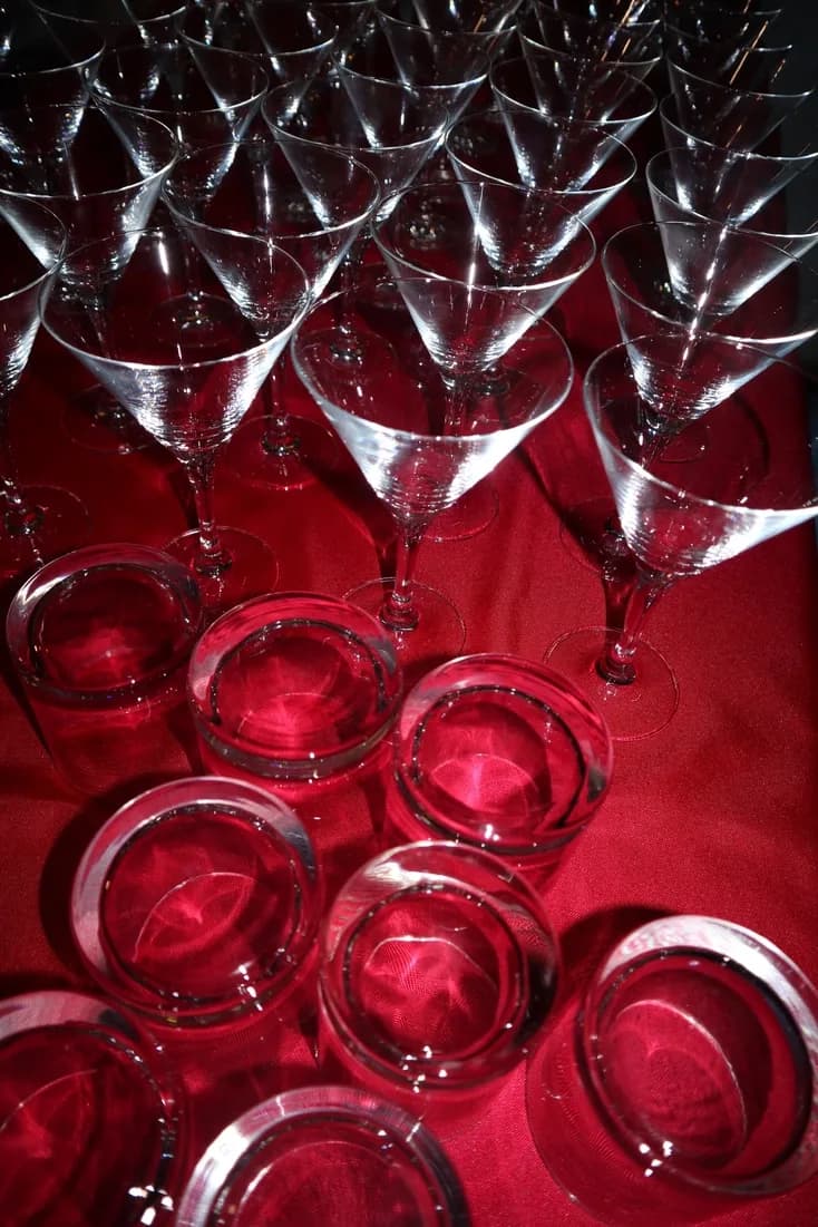 Rows of martini glasses set up for an event